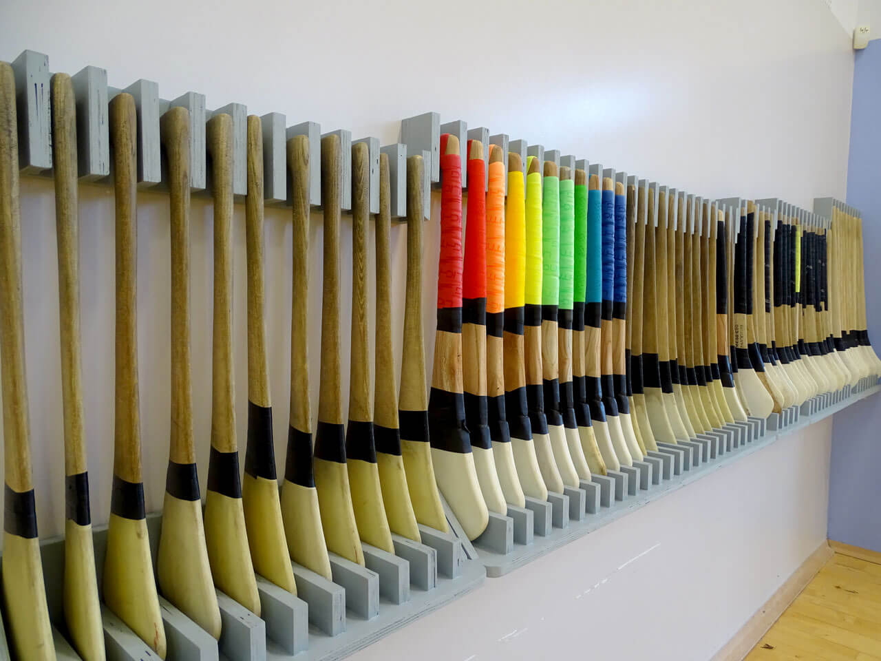 Photo of hurleys in Gaelscoil Mhichíl Uí Choileáin